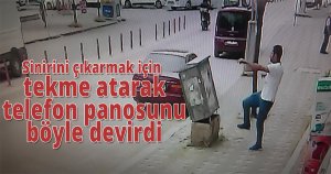 Sinirini çıkarmak için tekme atarak telefon panosunu böyle devirdi
