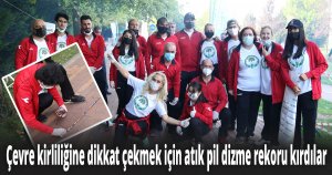 Çevre kirliliğine dikkat çekmek için atık pil dizme rekoru kırdılar