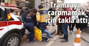 Tramvaya çarpmamak için takla attı