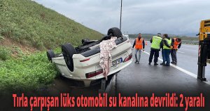 Tırla çarpışan lüks otomobil su kanalına devrildi