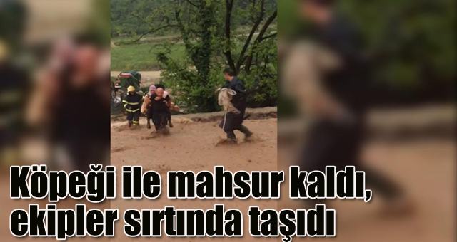 Köpeği ile mahsur kaldı, ekipler sırtında taşıdı