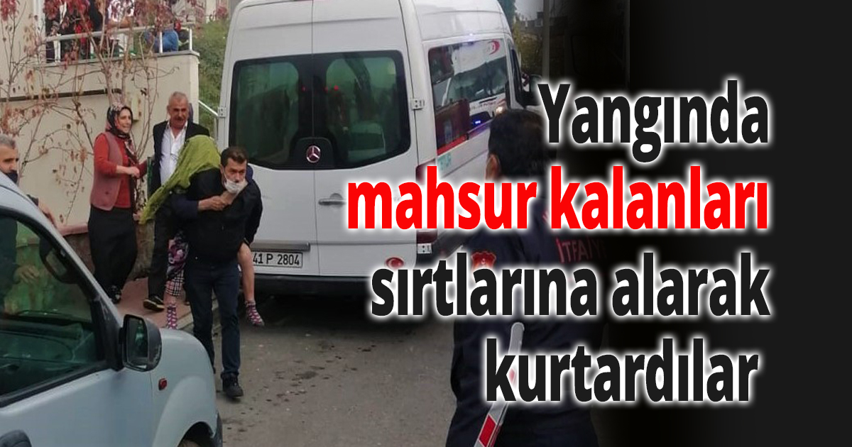 Yangında mahsur kalanları sırtlarına alarak kurtardılar