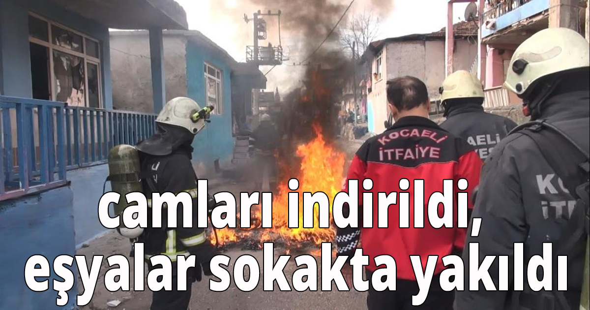 Camlar indirildi, eşyalar sokakta yakıldı