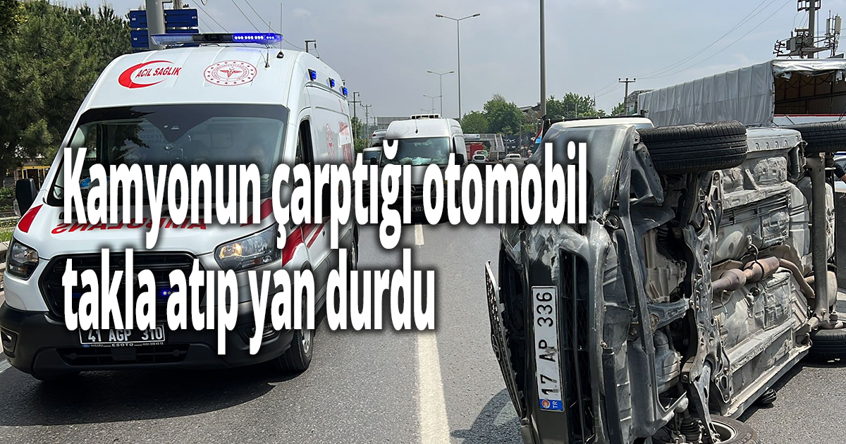 Kamyonun çarptığı otomobil takla atıp yan durdu