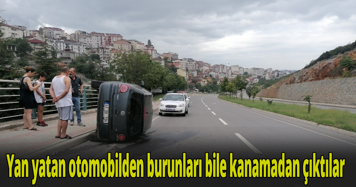 Yan yatan otomobilden burunları bile kanamadan çıktılar