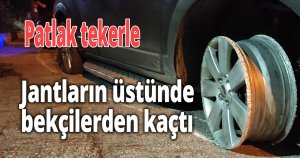 Patlak tekerle, jantların üstünde bekçilerden kaçtı