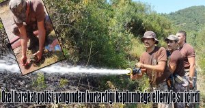 Özel harekat polisi, yangından kurtardığı kaplumbağa elleriyle su içirdi