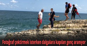 Fotoğraf çektirmek için kayalara tırmandı