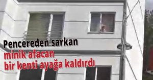 Pencereden sarkan minik afacan bir kenti ayağa kaldırdı