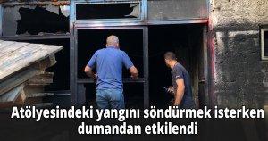Atölyesindeki yangını söndürmek isterken dumandan etkilendi