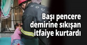 Başı pencere demirine sıkışan çocuğu itfaiye kurtardı