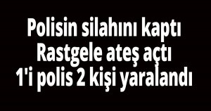 Polisin silahını kaptı