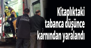 Kitaplıktaki tabanca düşünce karnından yaralandı