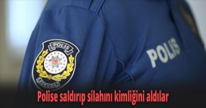 Polise saldırıp silahını kimliğini aldılar