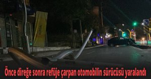 Önce direğe sonra refüje çarpan otomobilin sürücüsü yaralandı