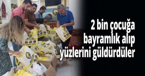 2 bin çocuğa bayramlık alıp yüzlerini güldürdüler