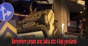 Bariyerlere çarpan araç takla attı