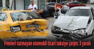 Frenleri tutmayan otomobil ticari taksiye çarptı